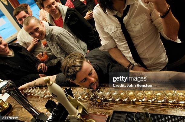 riotous drinking party in public bar  - alcoholisme stockfoto's en -beelden