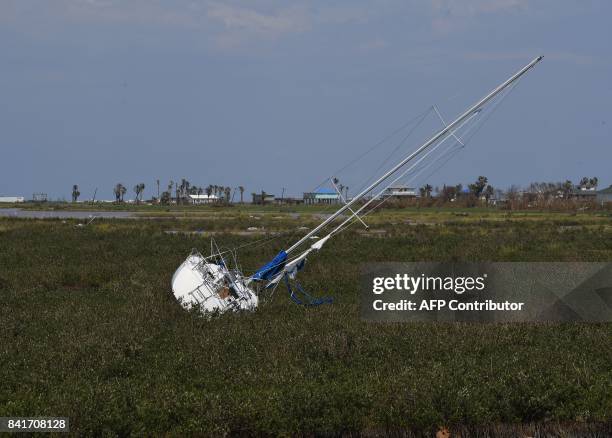 Yacht that was washed up onto dry land after Hurricane Harvey caused widespread destruction in Rockport, Texas on September 1, 2017. / AFP PHOTO /...