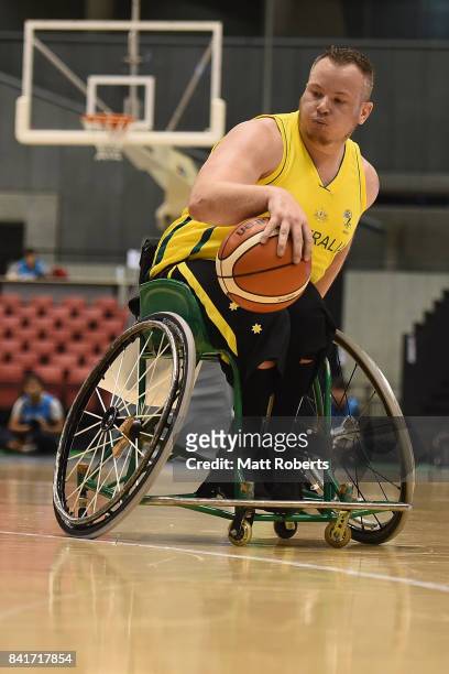 Shaun Norris of Australia controls the ball during the Wheelchair Basketball World Challenge Cup final between Australia and Great Britain at the...
