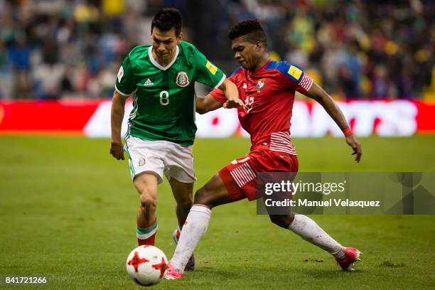Luis Ovalle of Panama struggles for the ball with Hirving Lozano of Mexico during the match between Mexico and Panama as part of the FIFA 2018 World...