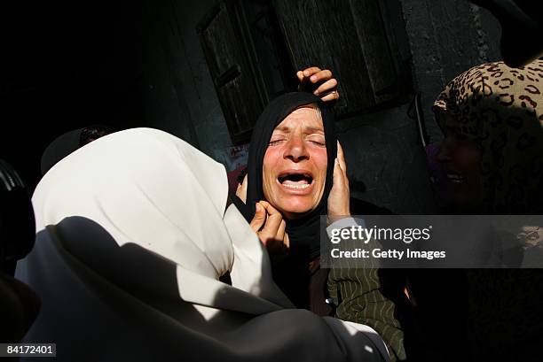 Relatives mourn the death of 20-year-old Mohamad Abo Shaar during his funeral, who was killed during an overnight Israeli airstrike on January 5,...