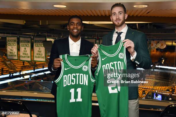 Kyrie Irving and Gordon Hayward pose for a picture holding their jerseys before their introduction as Boston Celtics on September 1, 2017 at the TD...