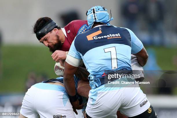 Elliot Dixon of Southland is tackled by Jack Ram of Northland during the round three Mitre 10 Cup match between Southland and Northland at Rugby Park...