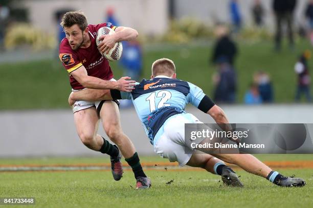 Scott Eade of Southland is tackled by Jack Goodhue of Northland during the round three Mitre 10 Cup match between Southland and Northland at Rugby...