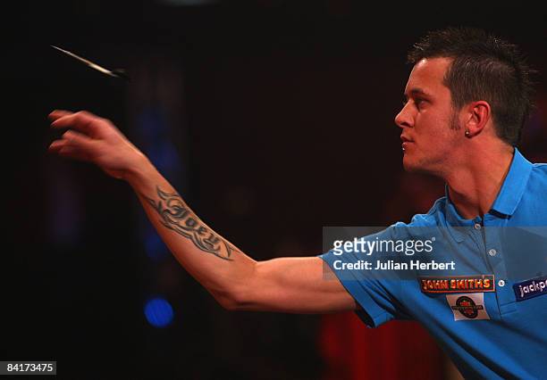 Joey Ten Berge of The Netherlands in action against Martin Atkins of England during the Lakeside World Darts Championships 1st Round match at...