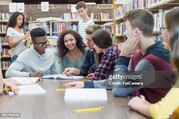 studying in library - secondary school reading stock pictures, royalty-free photos & images