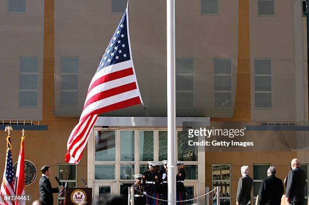 The US flag is raised during a formal dedication ceremony attended by the Iraqi President Jalal Talabani, at the new US embassy amid heavy security,...