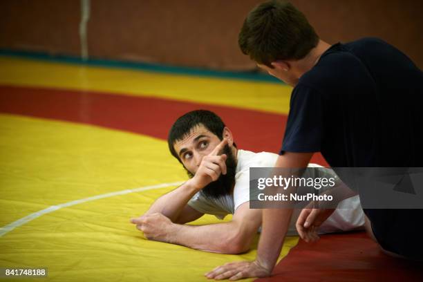 Ismail teaches something to an other member of the TOAC Wrestling Club during a training. On 1st September 2017 in Toulouse, France.