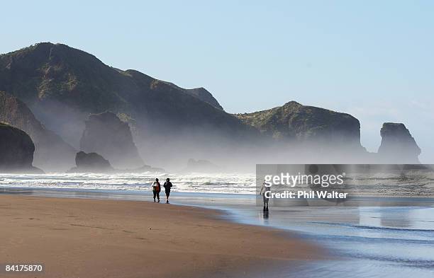 Friends and family walk the coastline as the search continues for NRL player Sonny Fai at Bethells Beach January 6, 2009 in Auckland, New Zealand....