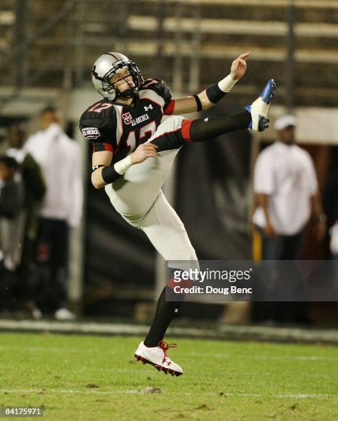 Punter Dustin Hopkins of the black team follows through on a punt in the All America Under Armour Football Game at Florida Citrus Bowl on January 4,...