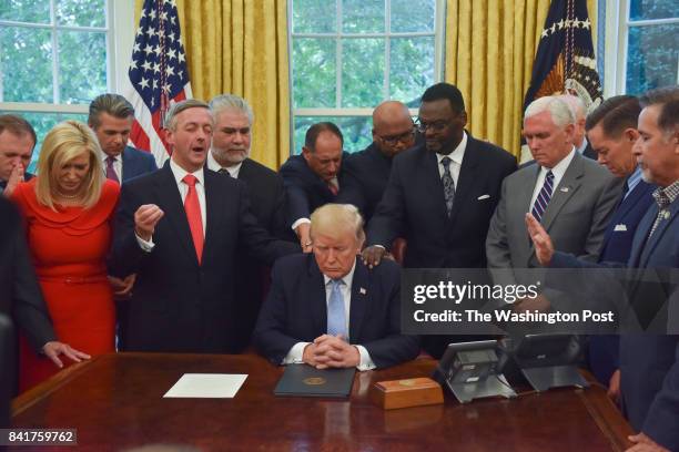 Donald J. Trump was prayed for by faith leaders after signing a proclamation for a National Day of Prayer for victims of Hurricane Harvey and the...