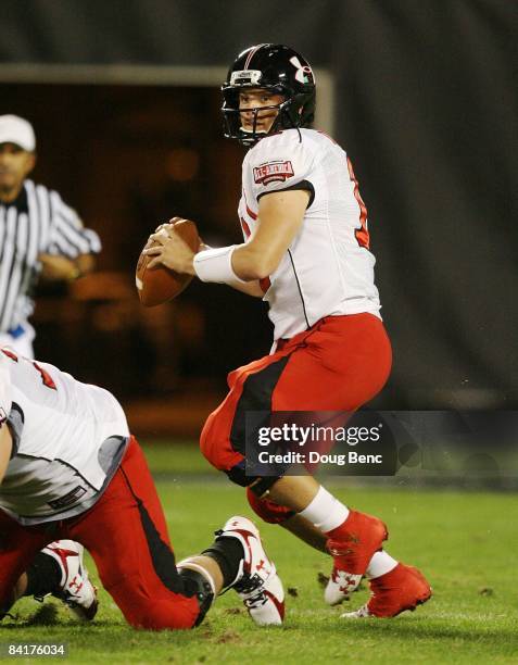 Quarterback Richard Brehaut of the white team drops back to pass in the All America Under Armour Football Game at Florida Citrus Bowl on January 4,...