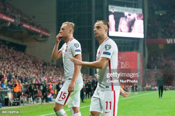 Kamil Glik and Kamil Grosicki of Poland dejected during the FIFA World Cup 2018 Qualifying Round between Denmark and Poland at Telia Parken Stadium...