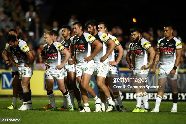 Pete Wallace of the Panthers and team mates look dejected during the round 26 NRL match between the Manly Sea Eagles and the Penrith Panthers at...