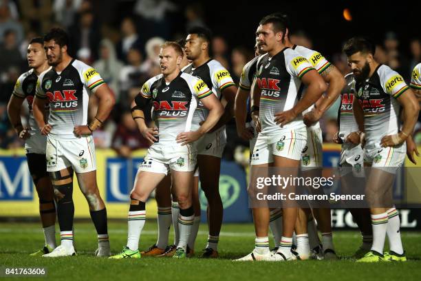 Pete Wallace of the Panthers and team mates look dejected during the round 26 NRL match between the Manly Sea Eagles and the Penrith Panthers at...