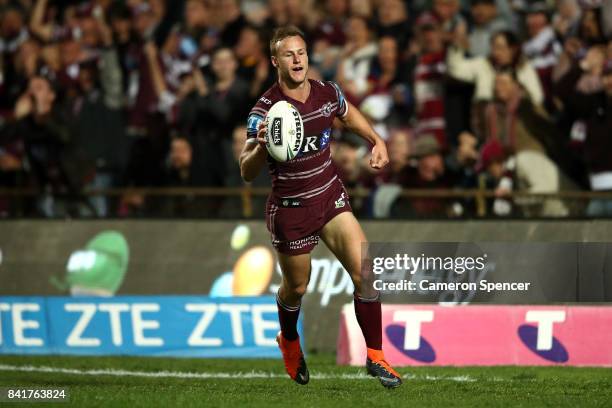 Daly Cherry-Evans of the Sea Eagles scores a try during the round 26 NRL match between the Manly Sea Eagles and the Penrith Panthers at Lottoland on...