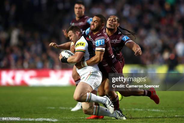 Trent Merrin of the Panthers is tackled during the round 26 NRL match between the Manly Sea Eagles and the Penrith Panthers at Lottoland on September...