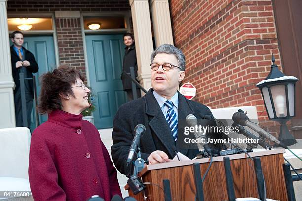 Senate candidate Al Franken as his wife Franni looks on, delivers a speech to the media in front of his home after the Minnesota state Canvassing...