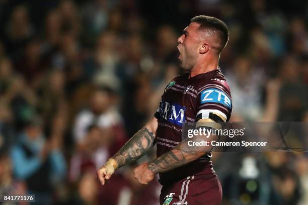 Curtis Sironen of the Sea Eagles celebrates scoring a try during the round 26 NRL match between the Manly Sea Eagles and the Penrith Panthers at...