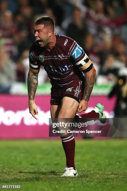 Curtis Sironen of the Sea Eagles celebrates scoring a try during the round 26 NRL match between the Manly Sea Eagles and the Penrith Panthers at...