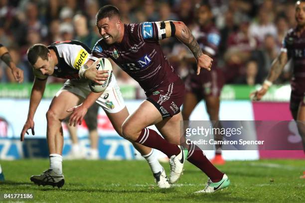Curtis Sironen of the Sea Eagles makes a break during the round 26 NRL match between the Manly Sea Eagles and the Penrith Panthers at Lottoland on...