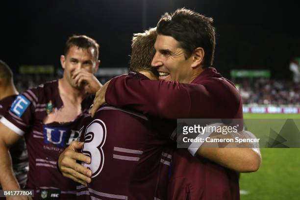 Sea Eagles coach Trent Barrett embraces Jake Trbojevic of the Sea Eagles after winning the round 26 NRL match between the Manly Sea Eagles and the...