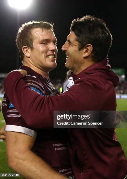 Sea Eagles coach Trent Barrett embraces Jake Trbojevic of the Sea Eagles after winning the round 26 NRL match between the Manly Sea Eagles and the...