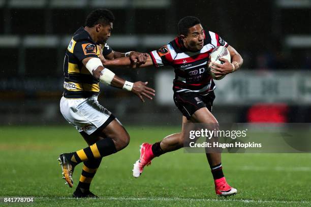 Luteru Laulala of Counties Manukau attempts to evade the tackle of Waisake Naholo of Taranaki during the round three Mitre 10 Cup match between...