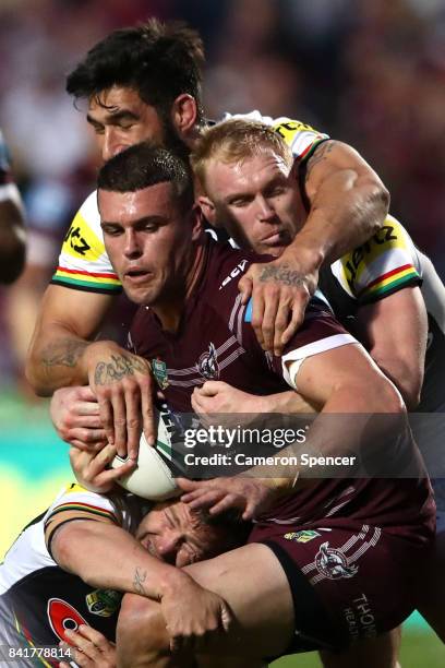 Darcy Lussick of the Sea Eagles is tackled during the round 26 NRL match between the Manly Sea Eagles and the Penrith Panthers at Lottoland on...