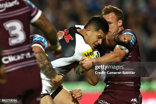 Dallin Watene-Zelezniak of the Panthers is tackled during the round 26 NRL match between the Manly Sea Eagles and the Penrith Panthers at Lottoland...