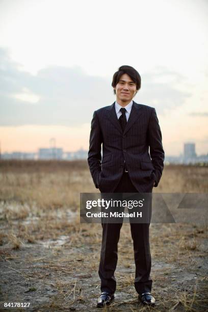 the businessman who stands in the vacant land - alternative view portraits stock-fotos und bilder