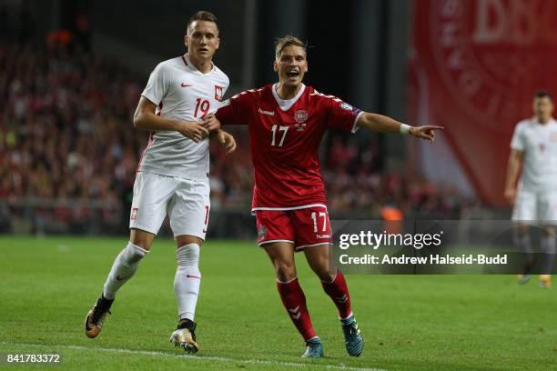 Jens Stryger Larsen of Denmark and Piotr Zielinski of Poland in action during the FIFA 2018 World Cup Qualifier between Denmark and Poland at Parken...