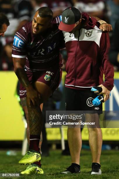 Addin Fonua-Blake of the Sea Eagles leaves the field injured during the round 26 NRL match between the Manly Sea Eagles and the Penrith Panthers at...