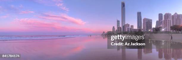 gold coast skyline at sunset reflecting off the water - surfers paradise stock pictures, royalty-free photos & images