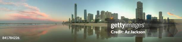 gold coast skyline at sunset reflecting off the water - gold coast skyline stock pictures, royalty-free photos & images