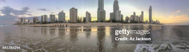 gold coast skyline at sunset reflecting off the water - gold coast skyline stock pictures, royalty-free photos & images