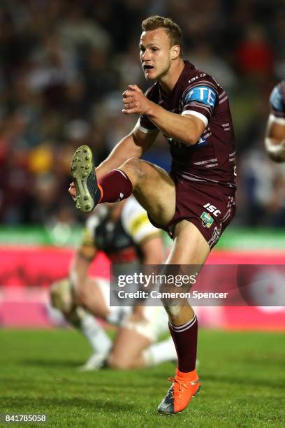 Daly Cherry-Evans of the Sea Eagles kicks ahead during the round 26 NRL match between the Manly Sea Eagles and the Penrith Panthers at Lottoland on...