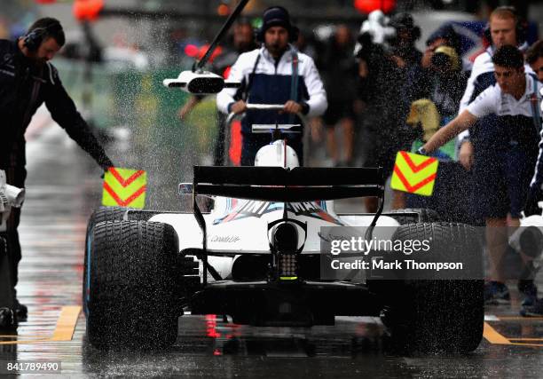 Felipe Massa of Brazil driving the Williams Martini Racing Williams FW40 Mercedes pulls into the pits during final practice for the Formula One Grand...