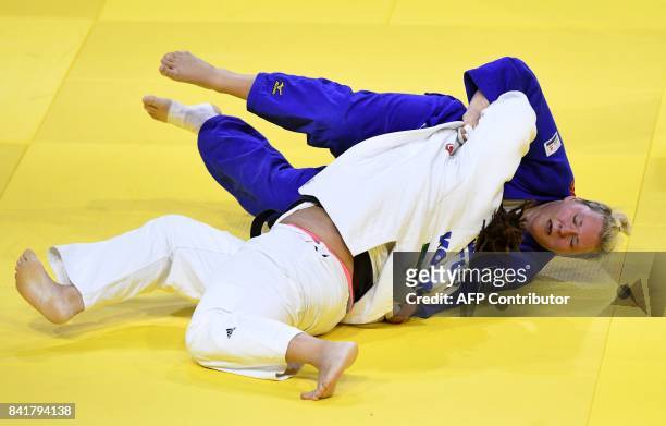 Gemany's Jasmin Kuelbs competes with Turkey's Kayra Sayit during their match in the womens +78kg category at the World Judo Championships in Budapest...