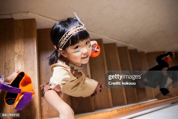 a girl trying to get down to the lower floor. - indian costume stock pictures, royalty-free photos & images