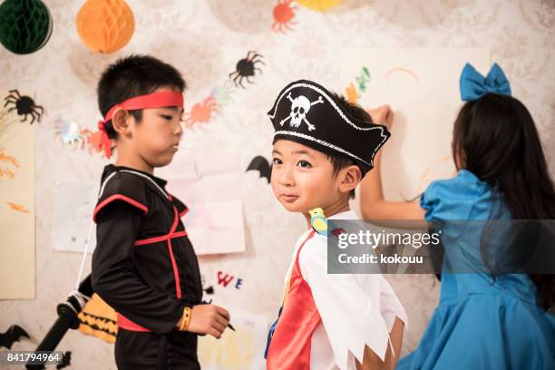 girls are painting in the children's room seriously. - princess pirates stock pictures, royalty-free photos & images