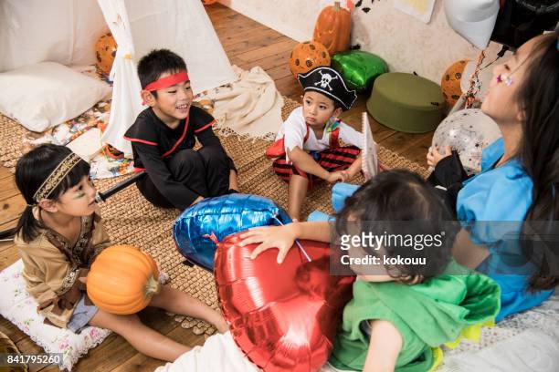 the children are talking in the children's room. - ninja kid stock pictures, royalty-free photos & images