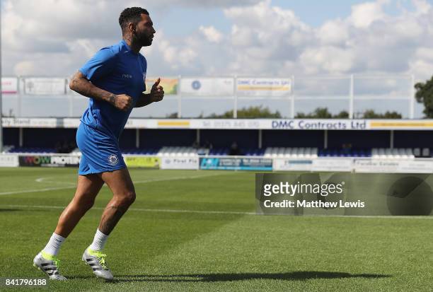 Jermaine Pennant of Billericay Town warms up ahead of The Emirates FA Cup Qualifying First Round match between Billericay Town and Didcot Town on...