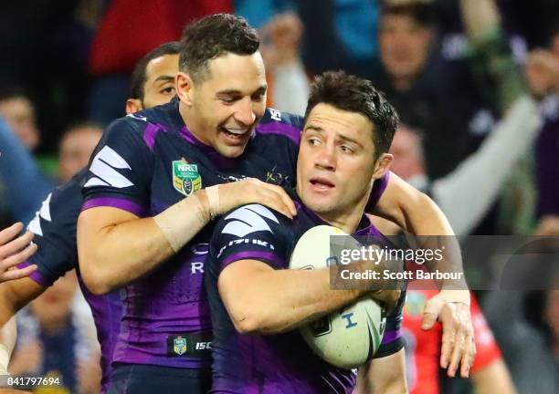 Cooper Cronk of the Storm is congratulated by Billy Slater after scoring a try which was later disallowed by the video referee for being off-side...