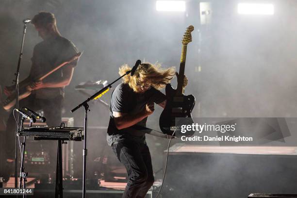 Musicians Drew Brown and Brent Kutzle of OneRepublic perform on stage at Mattress Firm Amphitheatre on September 1, 2017 in Chula Vista, California.