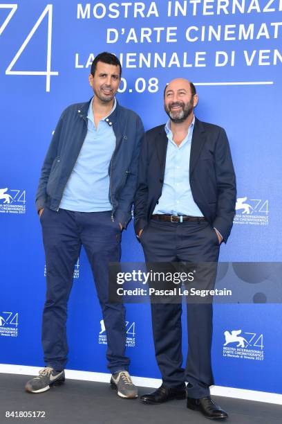 Samir Guesmi and Kad Merad attend the 'La Melodie' photocall during the 74th Venice Film Festival on September 2, 2017 in Venice, Italy.