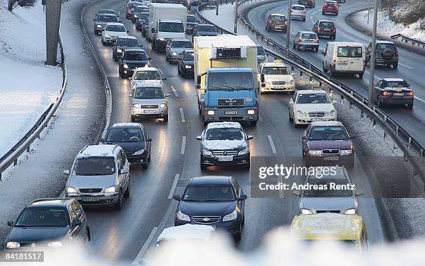 Cars and trucks stuck in a traffic jam on January 6, 2009 in Berlin, Germany. Freezing conditions with snow, ice and temperatures at 20 degrees below...