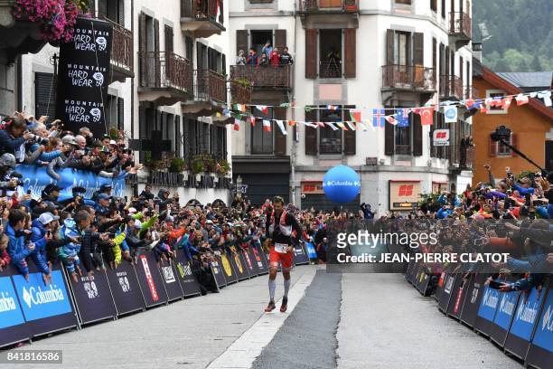 French athlete Francois D'Haene runs towards the finish line to win the 15th edition of the Ultra-Trail du Mont-Blanc , a 170 km race around the Mont...