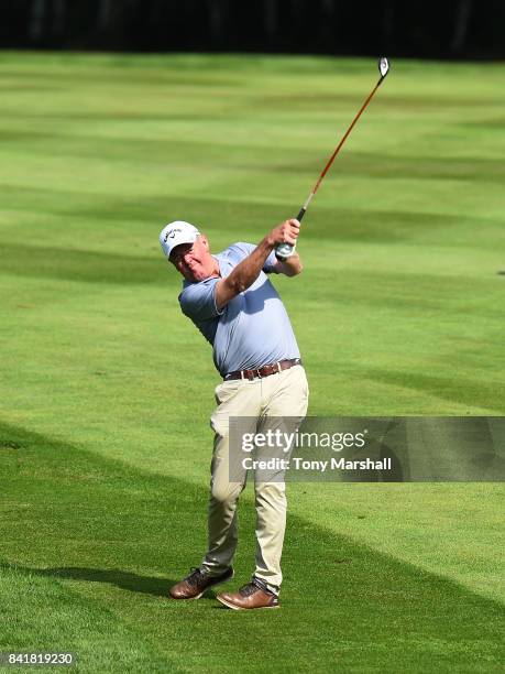 Greg Turner of New Zealand plays his second shot on the 1st fairway during the Travis Perkins Senior Masters - Day Two at Woburn Golf Club on...