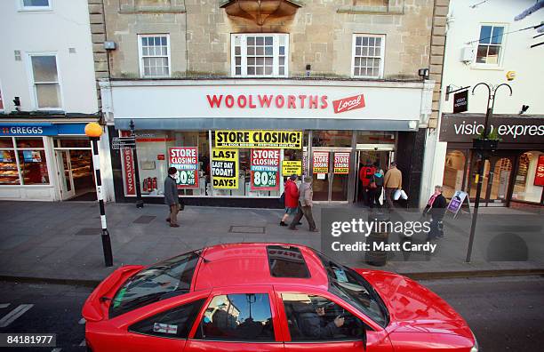 Shoppers enter a branch of Woolworths trading for the final time on January 6 in Wells, England. The closure of the high street store which has been...